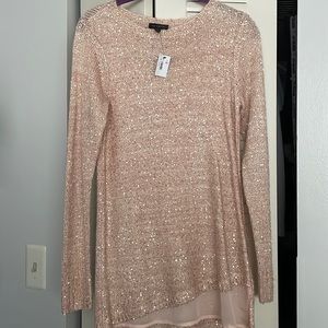 Women’s size XS lightweight sweater with sparkle detail.